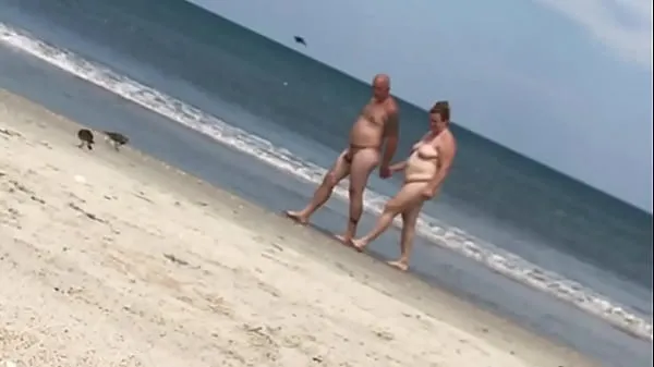 大ladies at a nude beach enjoying what they see总管